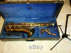 Tenor saxophone with case, stand and mouthpieces maybe Conn stencil